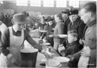 Evacuated Karelians are provided with a meal at the Savonlinna plywood factory in March 1940.