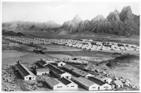 Hospital and dormitories shipped to Aden were situated at the foot of a mountainous landscape.